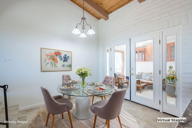 dining room featuring french doors, wood ceiling, light tile patterned floors, a chandelier, and vaulted ceiling with beams