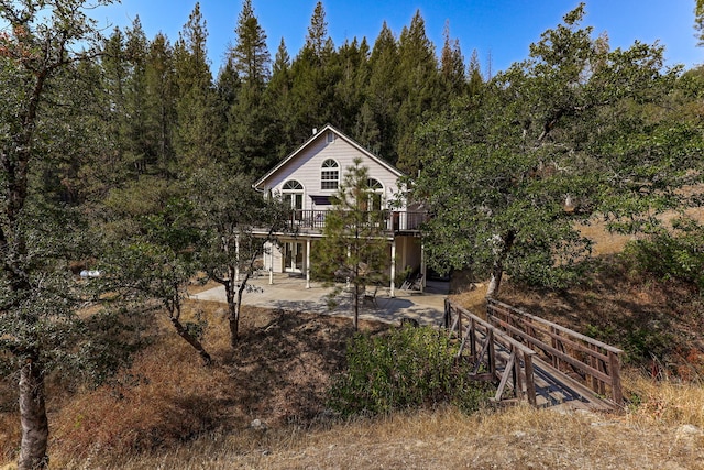 rear view of property with a patio area and a deck