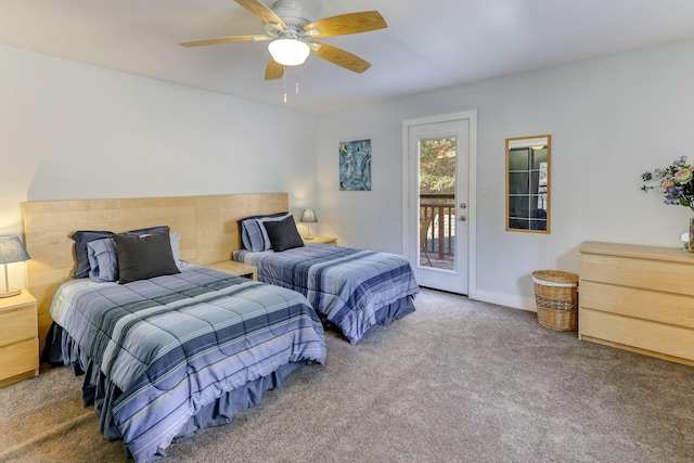 carpeted bedroom featuring access to exterior and ceiling fan