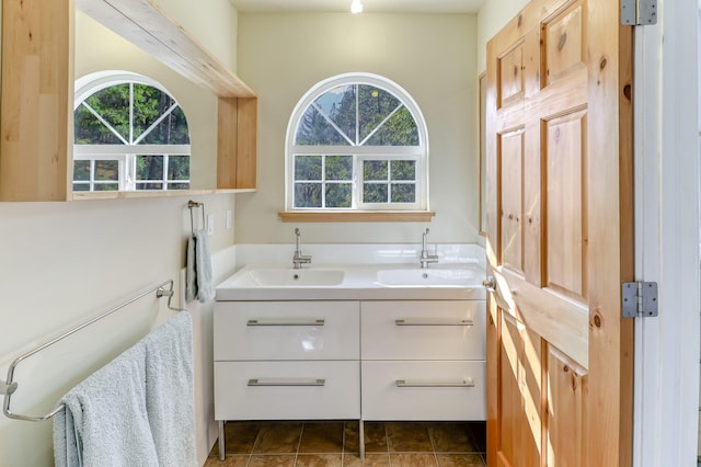 bathroom featuring vanity, tile patterned flooring, and plenty of natural light