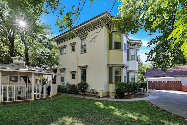 view of home's exterior with a lawn