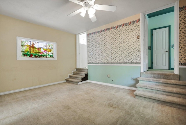 basement with carpet and ceiling fan