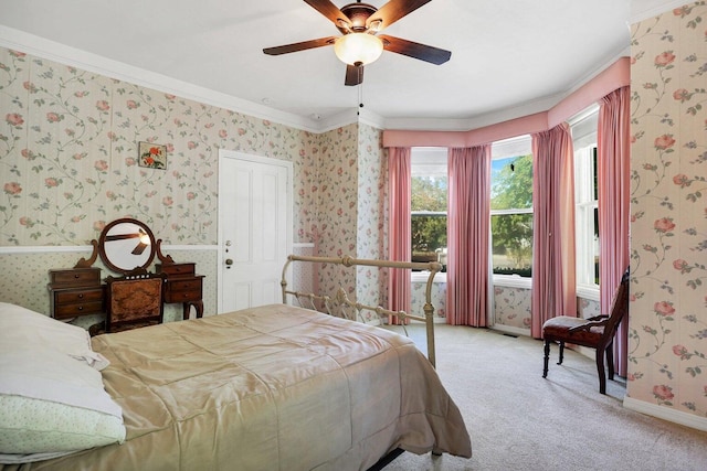 bedroom featuring crown molding, light carpet, and ceiling fan