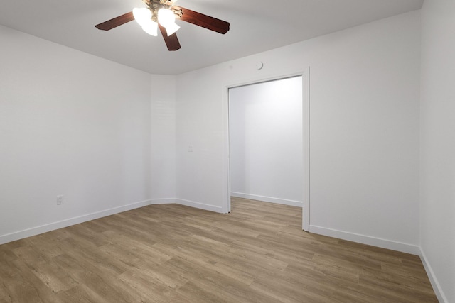 unfurnished room featuring ceiling fan and light wood-type flooring