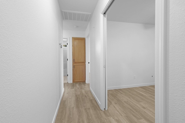 hall featuring light hardwood / wood-style flooring