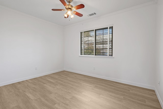 empty room with crown molding, ceiling fan, and light wood-type flooring