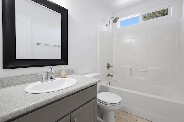 full bathroom featuring vanity, tile patterned floors, washtub / shower combination, and toilet