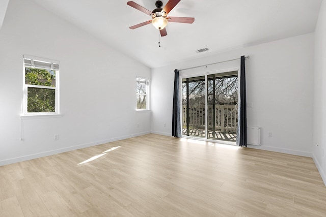 unfurnished room with vaulted ceiling, ceiling fan, and light wood-type flooring