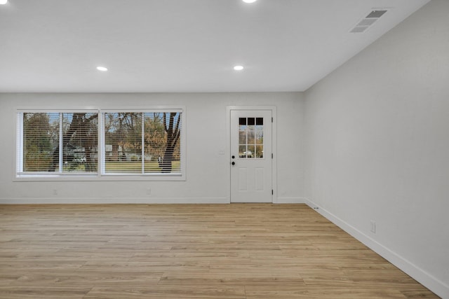 interior space featuring a healthy amount of sunlight and light hardwood / wood-style floors