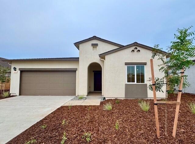 mediterranean / spanish-style house featuring a garage