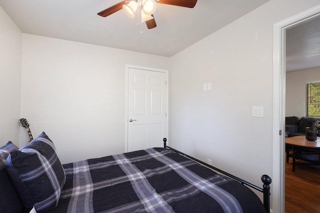 bedroom with hardwood / wood-style flooring and ceiling fan