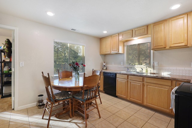 kitchen featuring a wealth of natural light, black dishwasher, sink, and range with electric stovetop