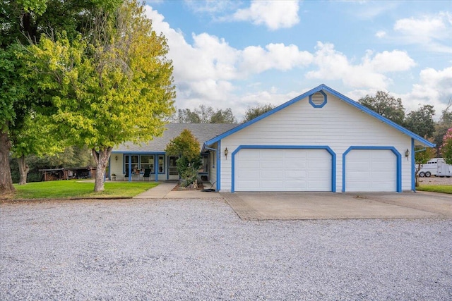 single story home featuring a front yard and a garage