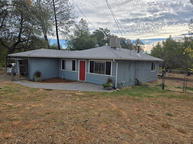 ranch-style home with a front lawn