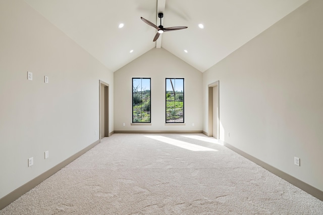 unfurnished room featuring light colored carpet, high vaulted ceiling, ceiling fan, beam ceiling, and baseboards