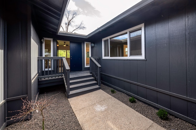 doorway to property featuring ceiling fan