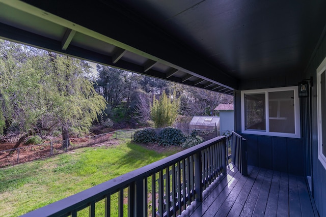 wooden deck with a yard