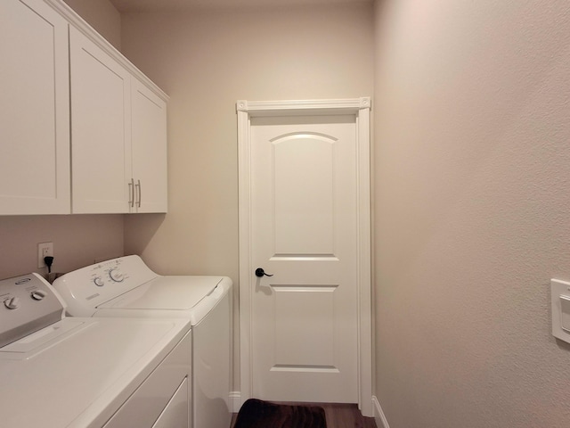 laundry room with cabinets and independent washer and dryer