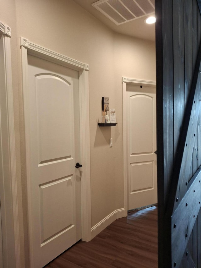 hallway featuring dark wood-type flooring