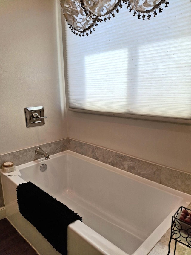 bathroom featuring a washtub