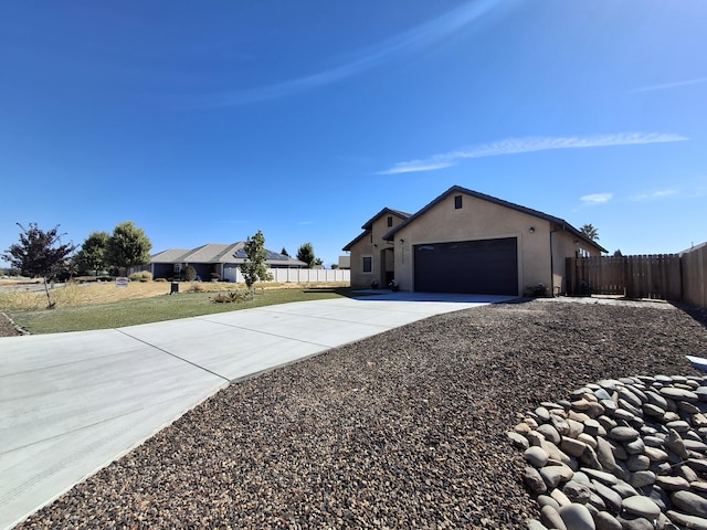 view of home's exterior with a garage and a yard