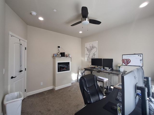 home office featuring carpet flooring and ceiling fan