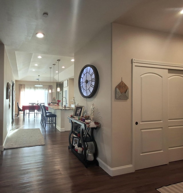 hallway with dark wood-type flooring