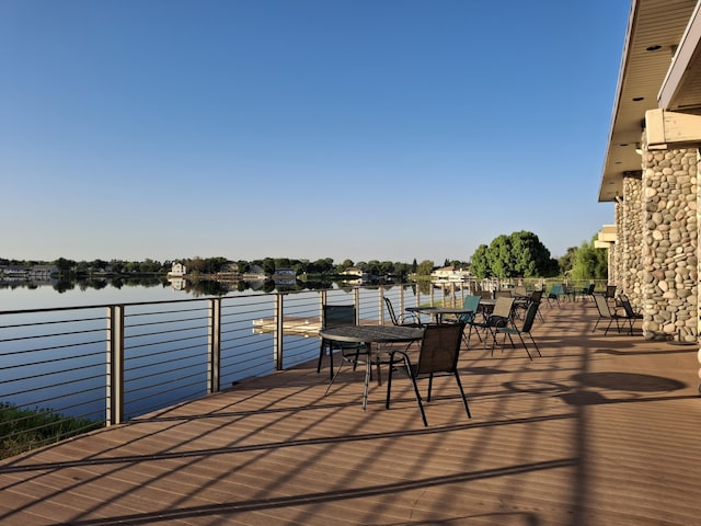 wooden deck with a water view