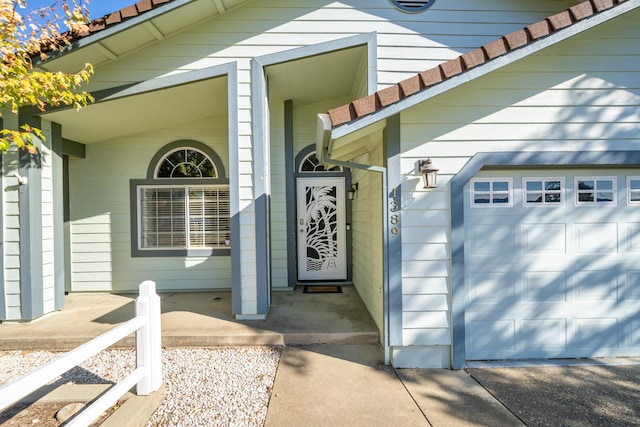 doorway to property featuring a garage