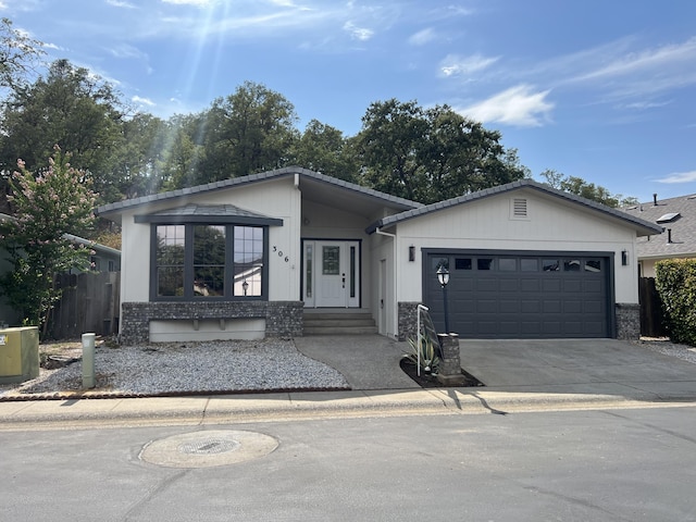 ranch-style home featuring a garage