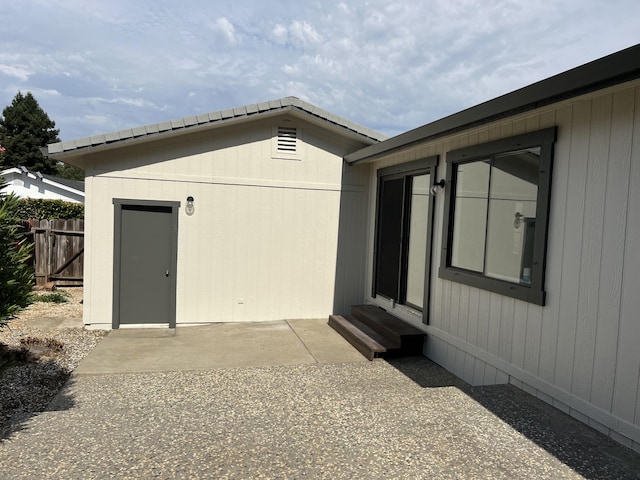 exterior space featuring a patio area and an outdoor structure