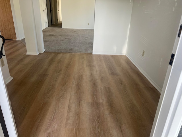 unfurnished room featuring hardwood / wood-style flooring