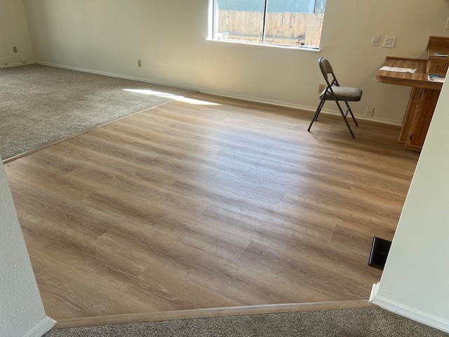 unfurnished room featuring light wood-type flooring