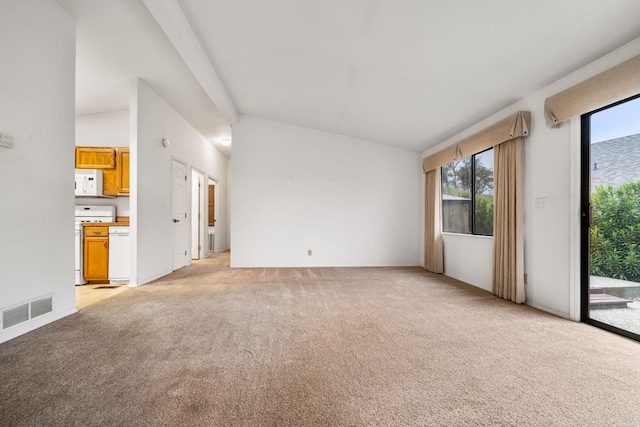 unfurnished living room with light carpet and lofted ceiling