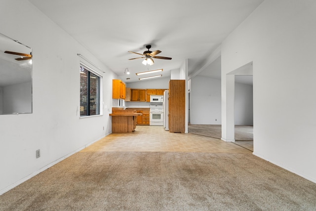 unfurnished living room with light carpet, lofted ceiling, and ceiling fan