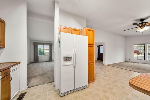 kitchen with ceiling fan, light colored carpet, and white appliances