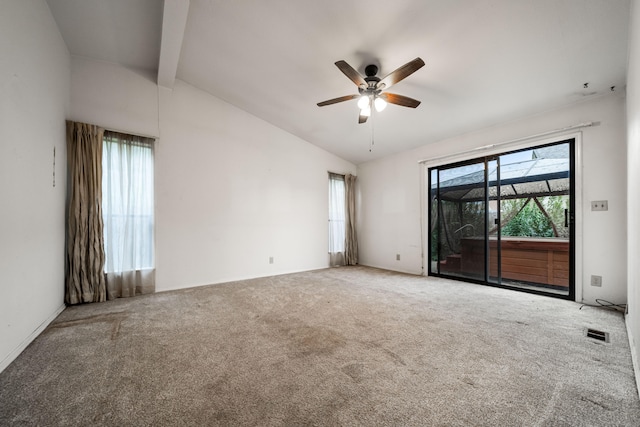 unfurnished room featuring carpet, vaulted ceiling with beams, and ceiling fan