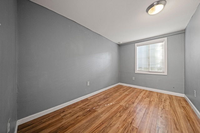 spare room featuring hardwood / wood-style floors