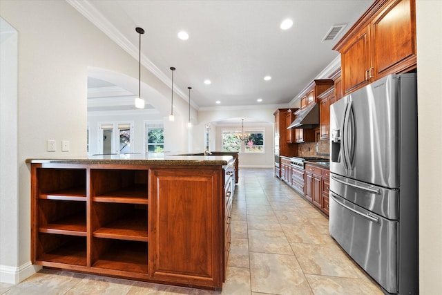 kitchen with tasteful backsplash, crown molding, appliances with stainless steel finishes, exhaust hood, and pendant lighting