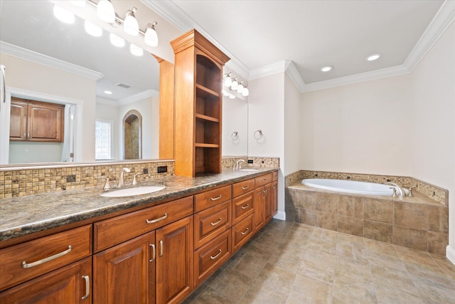 bathroom featuring a relaxing tiled tub, vanity, decorative backsplash, and crown molding