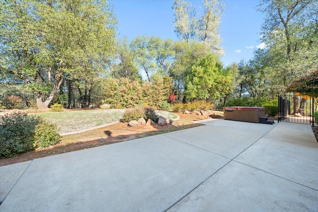 view of patio / terrace with a hot tub