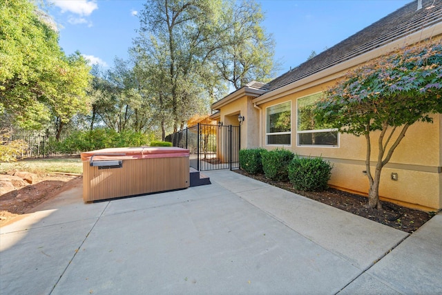 view of patio with a hot tub