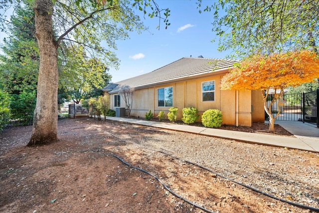 view of front of home featuring central air condition unit