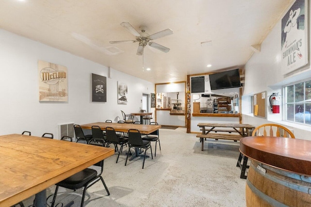 dining space featuring ceiling fan