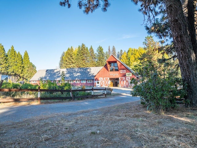 view of front of house with an outbuilding