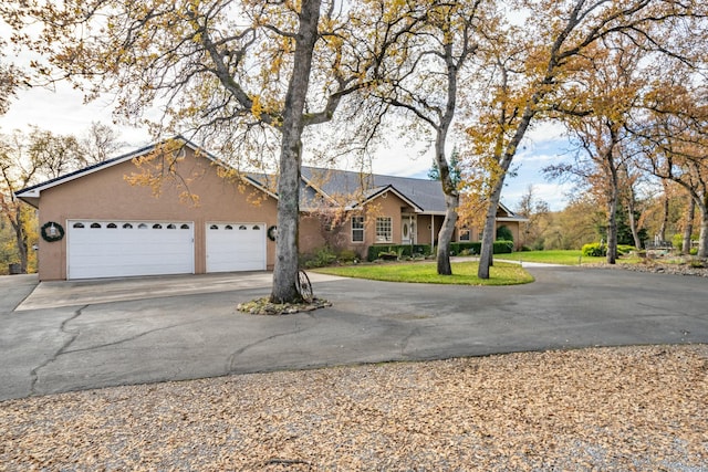 ranch-style home featuring a garage