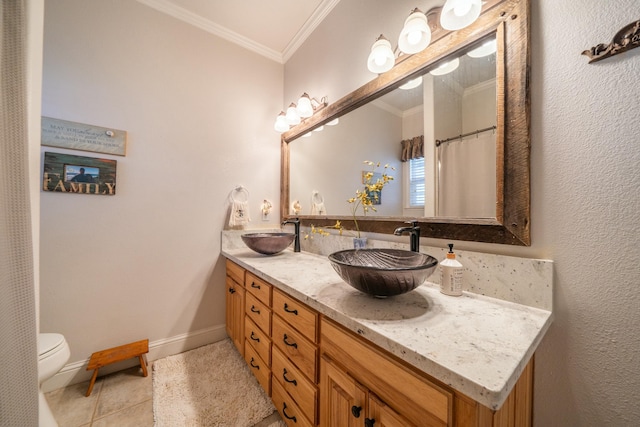 bathroom featuring toilet, tile patterned flooring, vanity, and ornamental molding