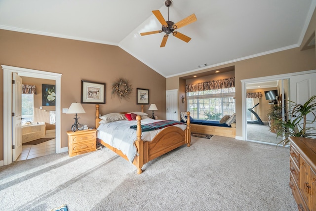 bedroom featuring ceiling fan, crown molding, ensuite bathroom, lofted ceiling, and light carpet