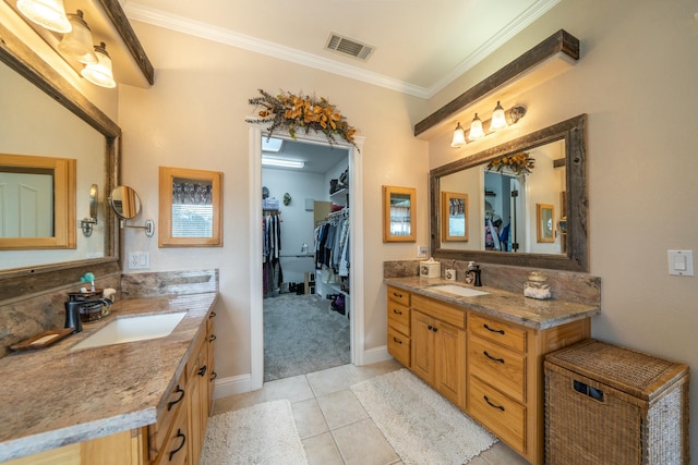 bathroom with tile patterned flooring, vanity, ornamental molding, and backsplash