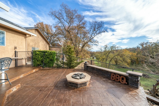 view of patio / terrace with an outdoor fire pit